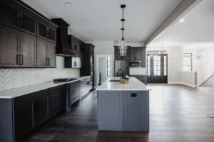 Black kitchen and blue island in new custom home located in western Ohio.