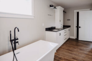 Modern bath with dual sink vanity in custom home located in Ohio