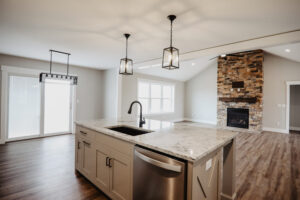 Kitchen island and fireplace in custom home located in Ohio
