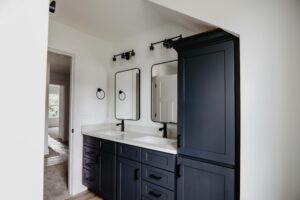 Blue bath vanity and linen clost in custom home located in western Ohio.