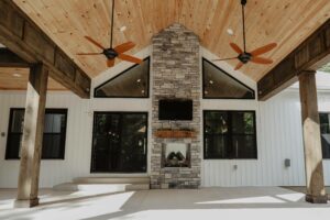 Outdoor fireplace on covered patio in custom home in near Tipp City, Ohio